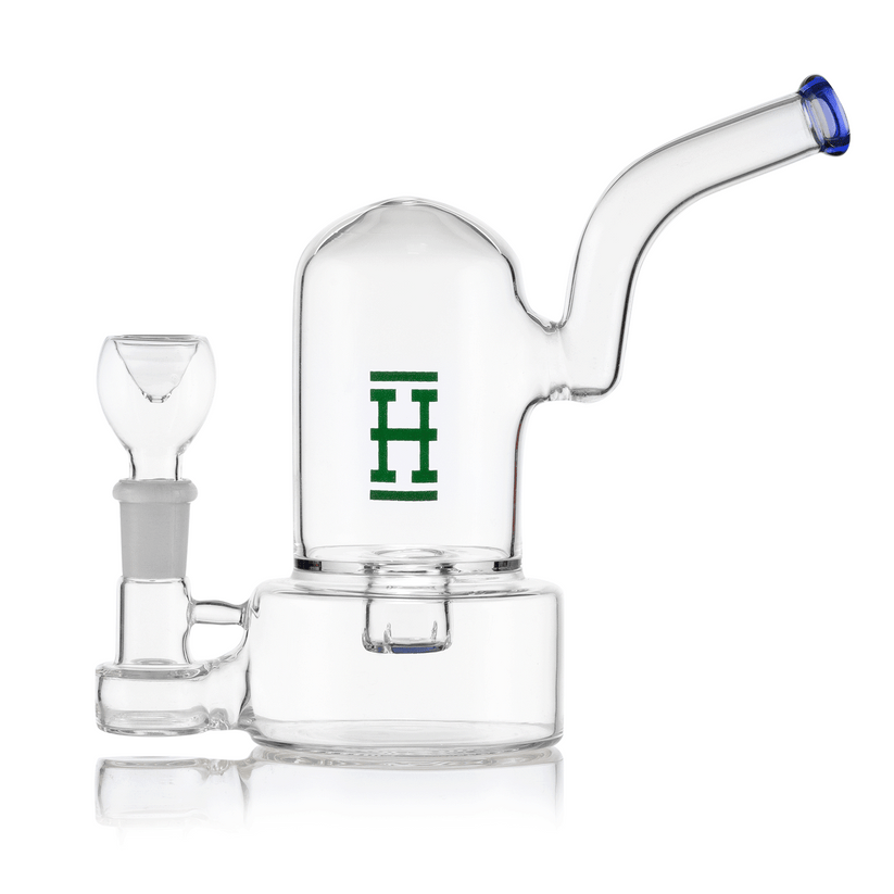 Side profile of Hemper bell bong with blue downstem and mouthpiece, clear bell-shaped chamber set on thick round base.
