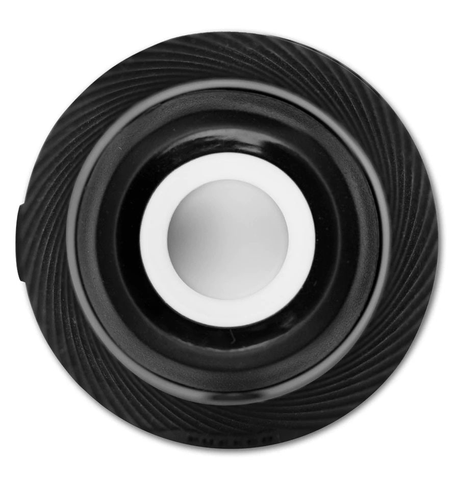 Overhead view into the Proxy’s ceramic chamber, circular bowl centered within the textured cap ring.