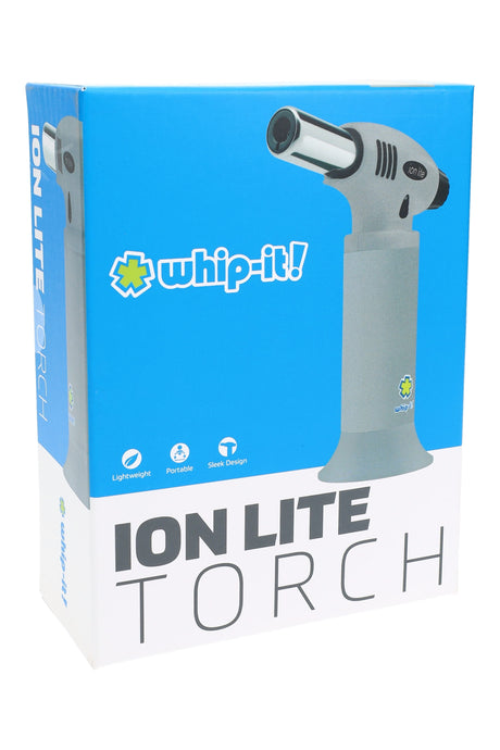 Whip-It Ion Lite torch gray colorway on packaging; slim handheld design with wide base and chrome nozzle.