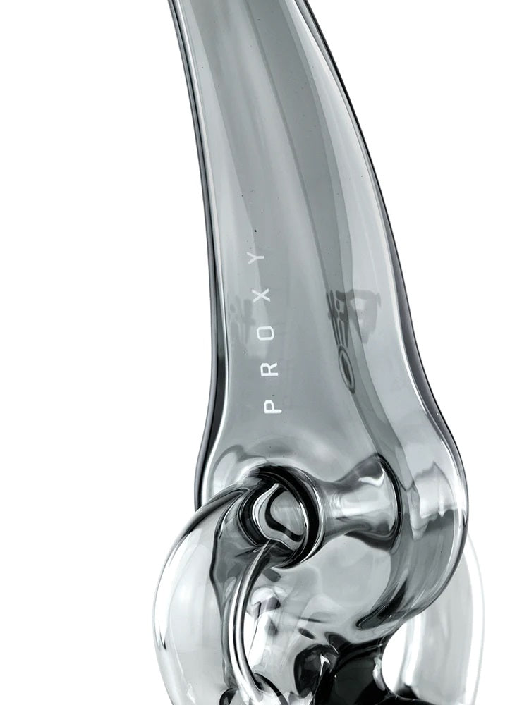Close view of “PROXY” lettering on curved smoke-tinted mouthpiece of Ryan Fitt recycler attachment
