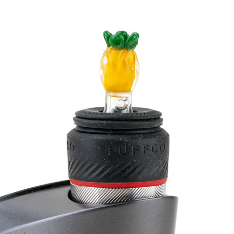 Pineapple ball cap installed on a Puffco Peak Pro, standing upright in the rubber collar to show fit, scale, and finished look.