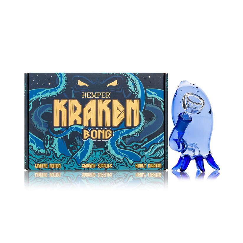 Hemper Kraken character glass bong beside full-color gift box, highlighting sea-monster artwork and retail packaging.