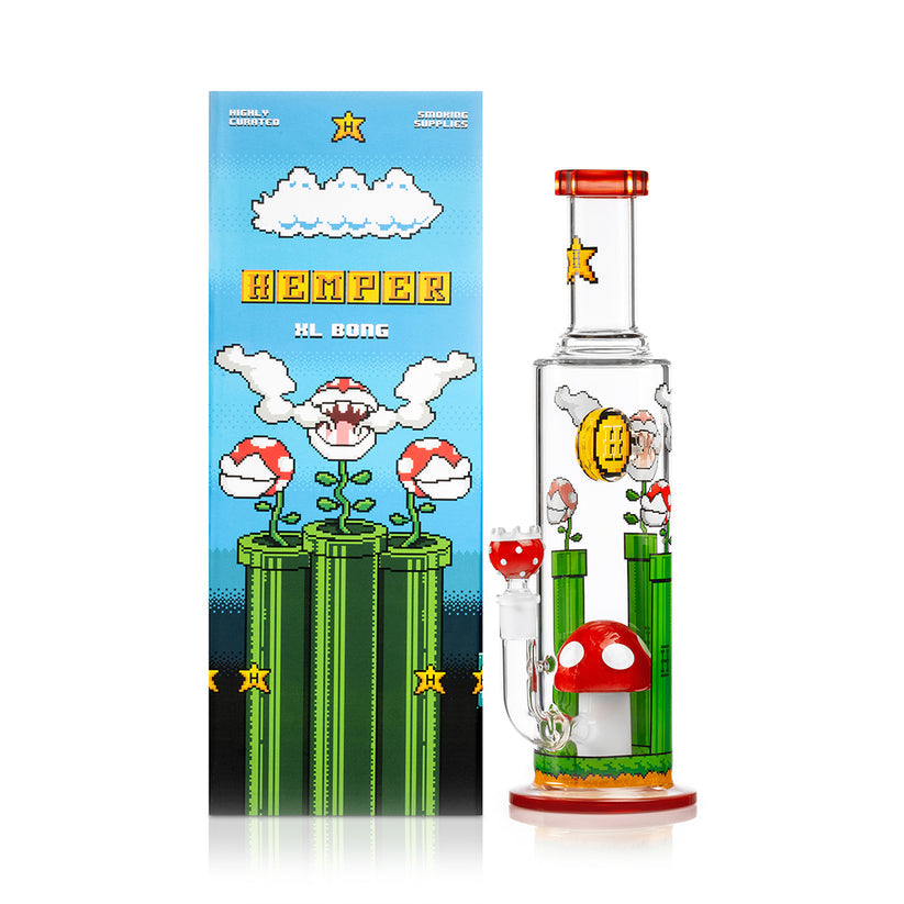 Front view of Hemper Gaming Flower XL 12″ glass bong with retro clouds, warp pipes and mushroom perc displayed next to matching gift box.