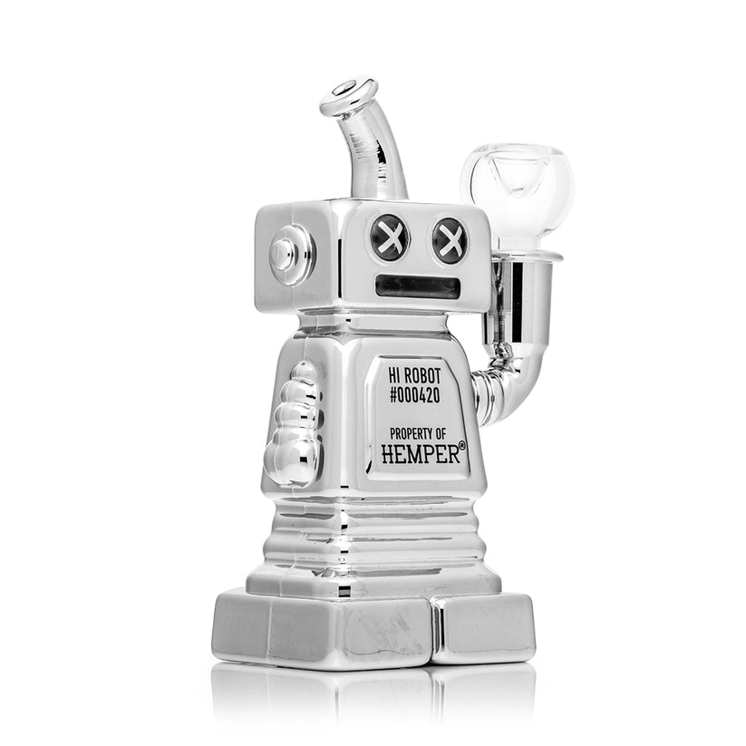 Three-quarter angle of chrome Hemper Hi-Robot 6″ glass bong showing etched panel, robot arm bowl joint and sturdy pedestal-style base.