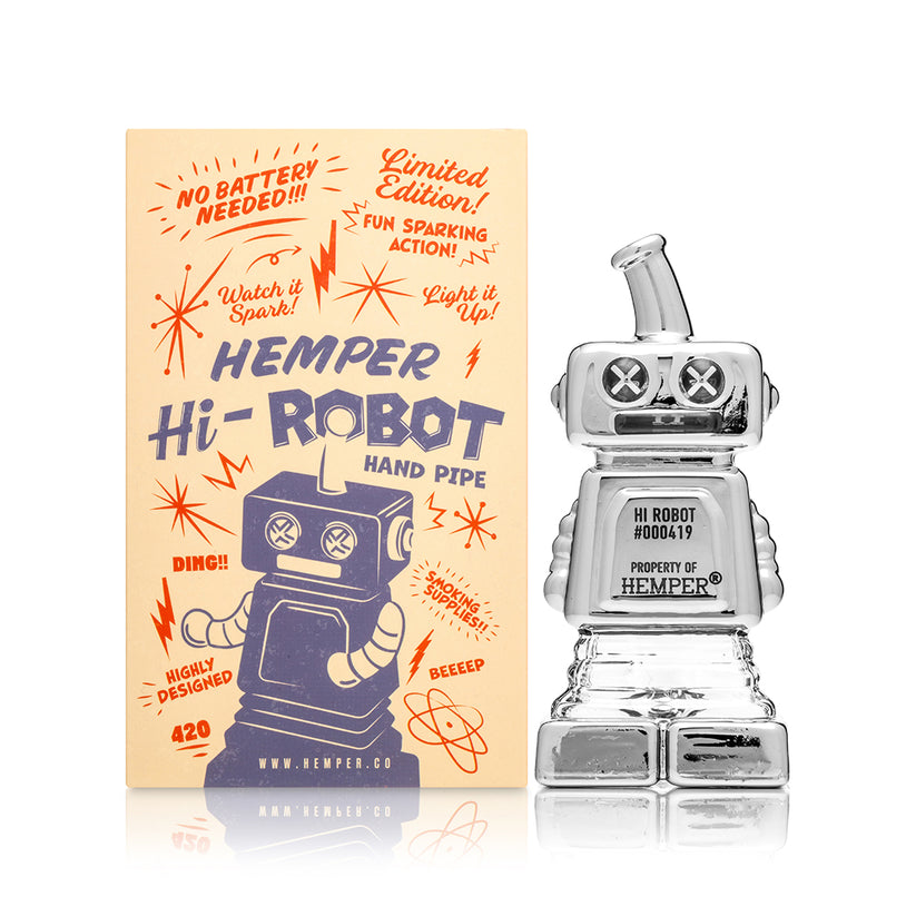Front view of Hemper Hi-Robot 4″ chrome glass hand pipe next to illustrated retail box, highlighting collectible robot design for home use.