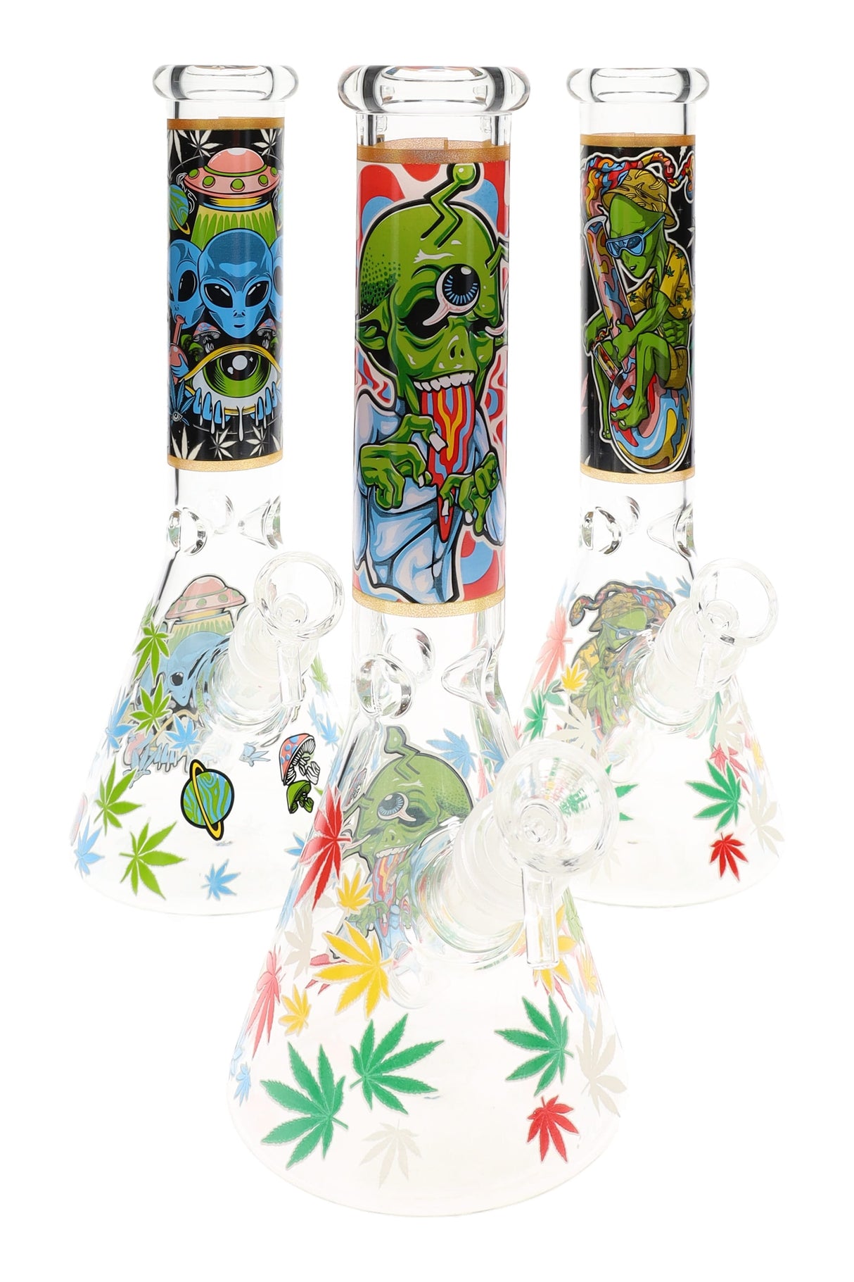 10″ glass beaker bong with glow-in-the-dark alien graphics, 18.8 mm joint and 14.5 mm bowl; three assorted designs shown, sold individually.