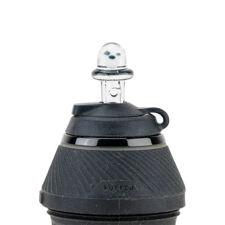 Daylight view of the Martian cap mounted on a Puffco Peak Pro, clear dome with alien detail facing forward.
