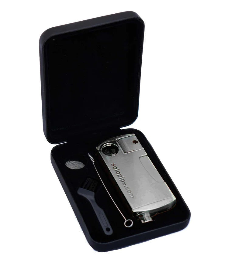 Chrome Solopipe presented in a protective hard-shell case with cleaning tools and spare screen, travel-ready setup.