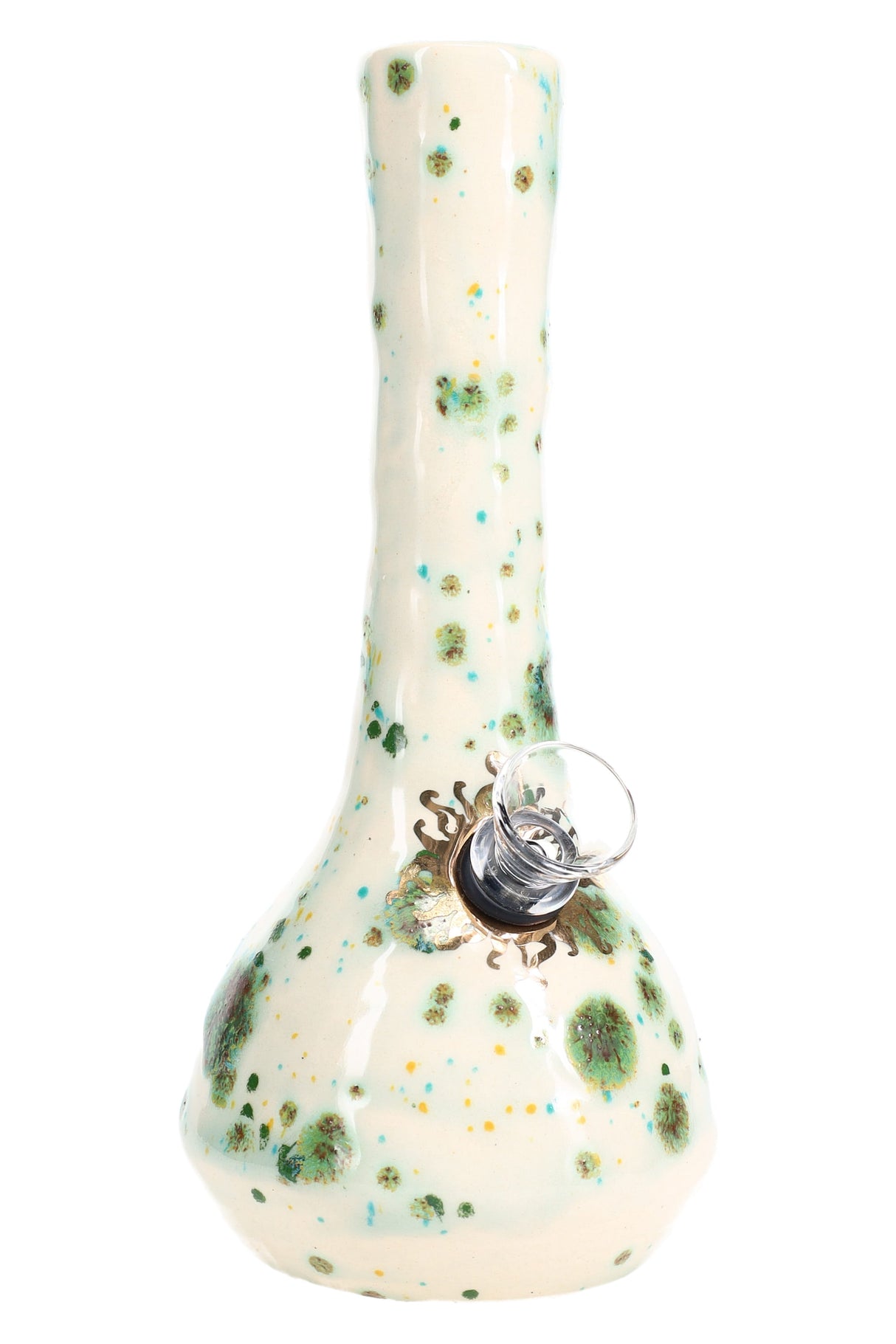 Off-white ceramic bong featuring teal and moss-green burst dots and gold accent, glass slide visible, studio lighting.
