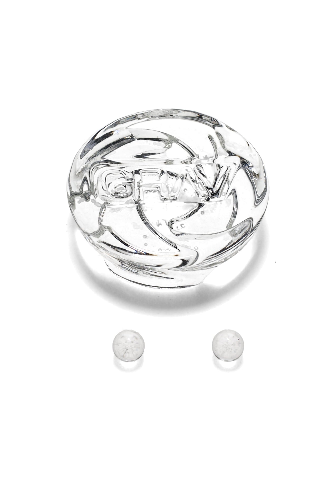 Clear GRAV spinner carb cap with embossed logo and two matching terp pearls, designed for flat-top quartz bangers, shown on white background.