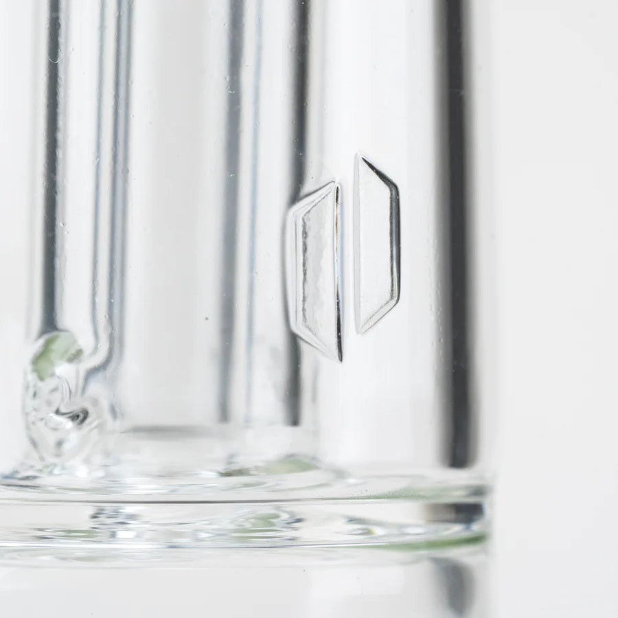 Macro view of clear borosilicate chamber with geometric accent on tall Peak Pro glass attachment