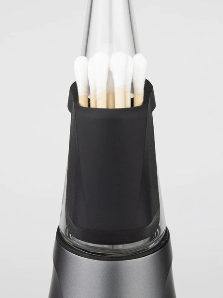 Close-up of backpack accessory on Peak Pro travel pack in Onyx, filled with cotton swabs for convenient tool storage.
