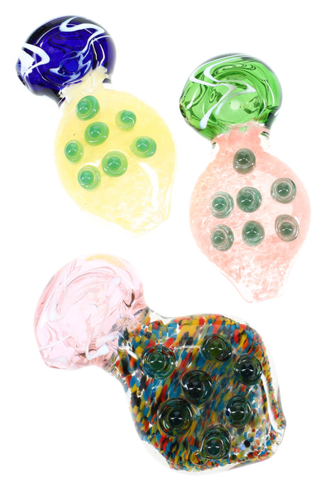 4½″ frit glass spoon pipe with wide mouthpiece, striped bowl cap, and six raised grip marbles on a flat paddle body in assorted colors.