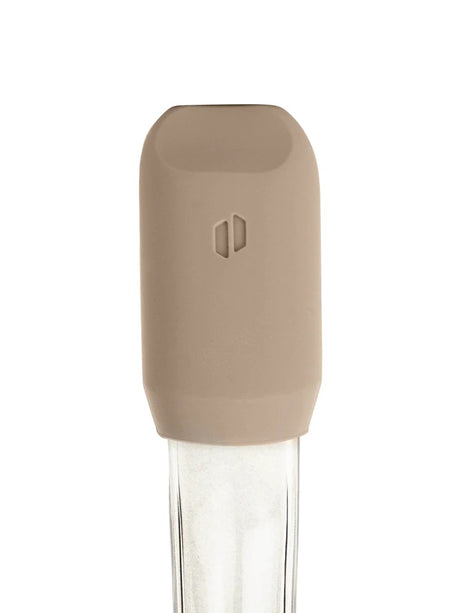 Desert silicone mouthpiece cap for Puffco Proxy shown on the glass stem, embossed Puffco logo centered on the tip.