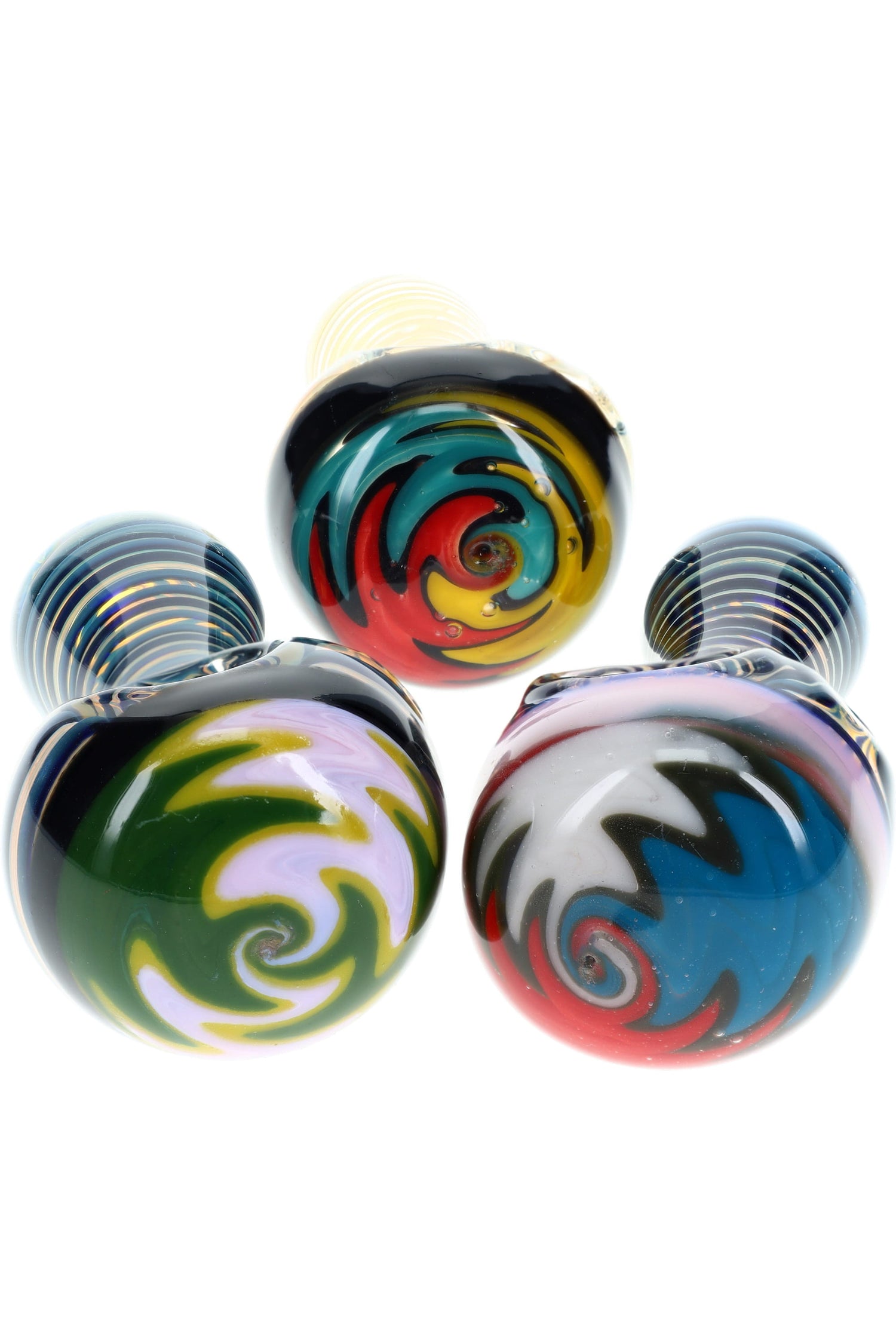 Three reverse-worked spoon bowls showing multicolor swirl caps on compact 4″ glass pipes; assorted colors, sold individually.