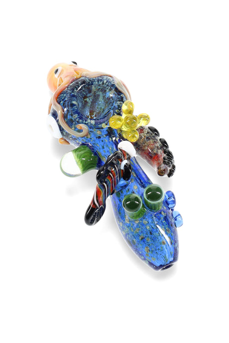 Blue frit glass hand pipe with ocean-life accents, raised coral and tentacles, side carb, and deep bowl; 4″ length, assorted colors.