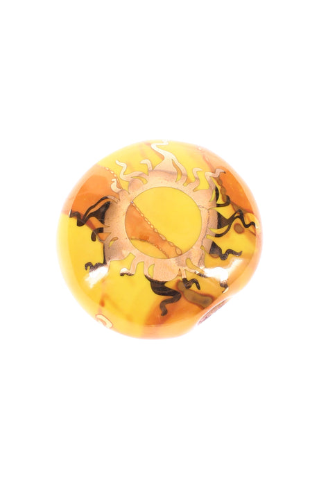 2-inch round yellow ceramic smoke stone hand pipe featuring a gold sun graphic, smooth finish.