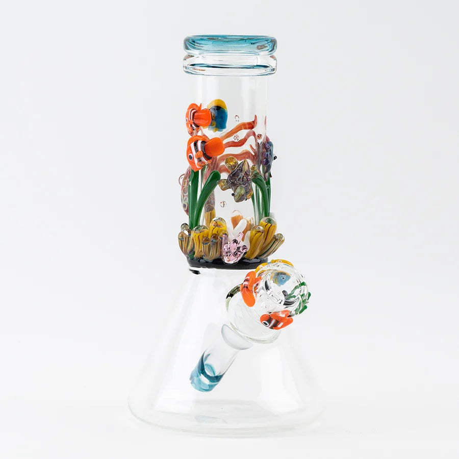 Front view of Empire Glassworks “Under the Sea” baby beaker with worked fish details and flared mouthpiece on a clear base.