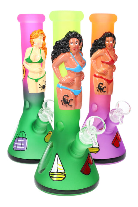 Trio of 10″ frosted glass beaker bongs with bikini-lady decorations, ice pinch, and multicolor gradient tubes.