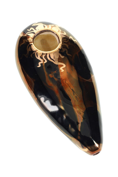 Black 4″ oval ceramic hand pipe with bronze marbling, gold sun trim, and brass screen bowl, high-gloss finish.
