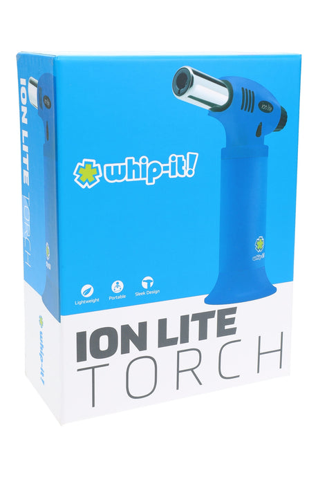 Whip-It Ion Lite torch in blue on retail box, compact handheld torch lighter with metal nozzle and flared base, right-facing view.