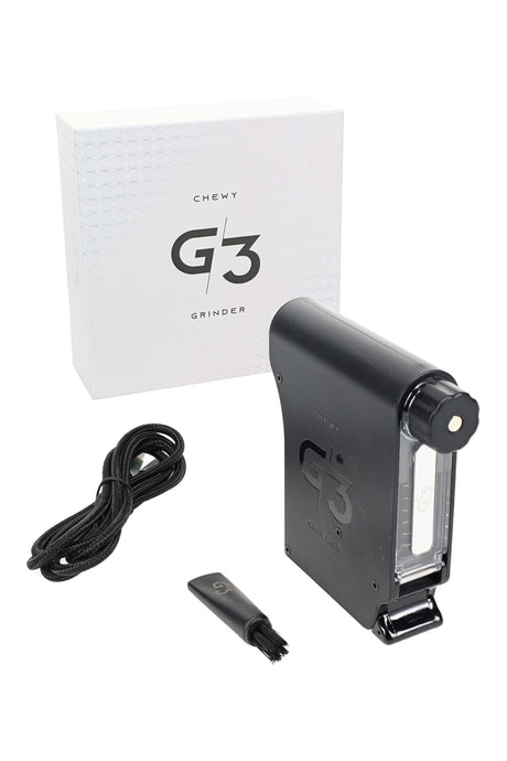 Chewy G3 electric herb grinder kit in black with USB-C cable and cleaning brush; portable trigger-load design with rechargeable battery.