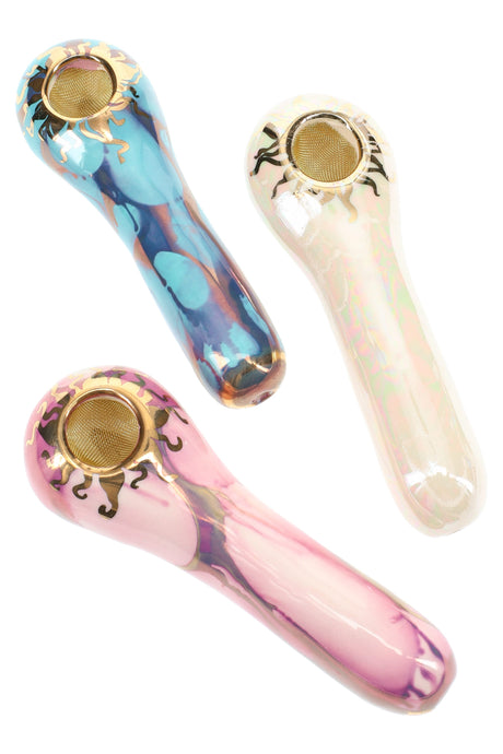 Three 4-inch ceramic spoon hand pipes with gold sun trim and brass screen bowls, glossy pastel and teal glazes.