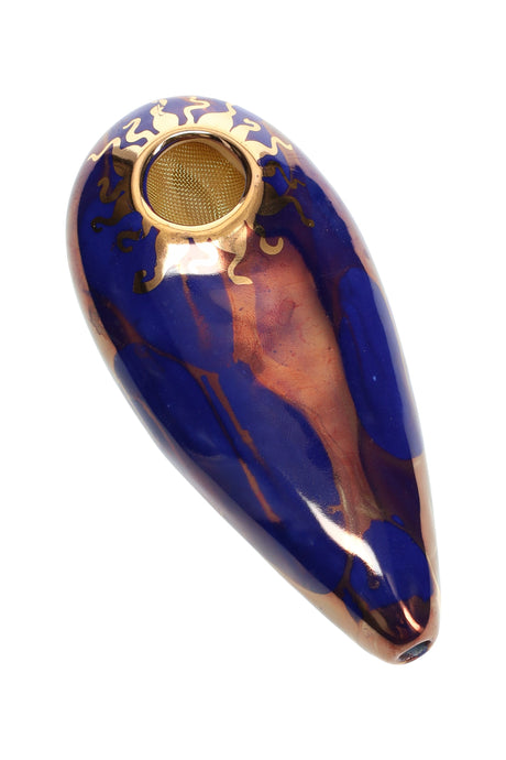 Royal blue 4″ oval ceramic hand pipe with gold sun rim and brass screen bowl, glossy marbled body.