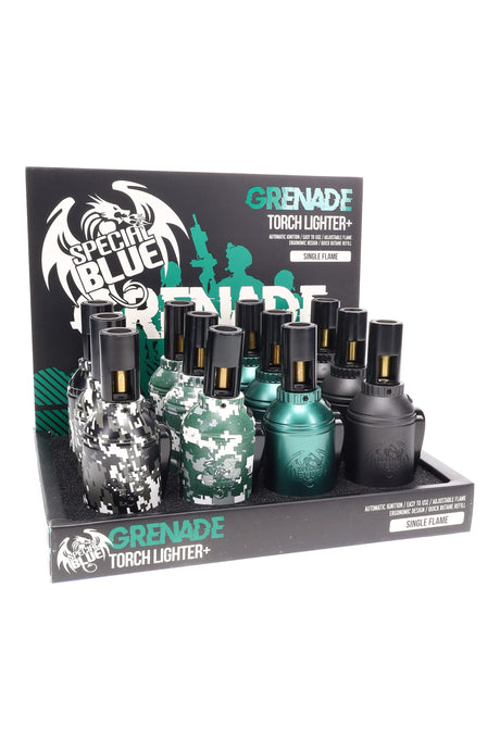 Counter display of twelve Special Blue grenade-style torch lighters in Pixels camo and solid colors, single-flame design with compact ergonomic grip.