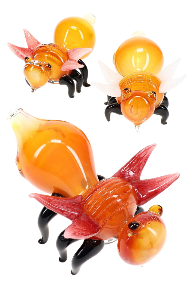 Color-changing gold-fumed glass fly hand pipe with amber body, red or white wings, and black standing legs — sold individually.