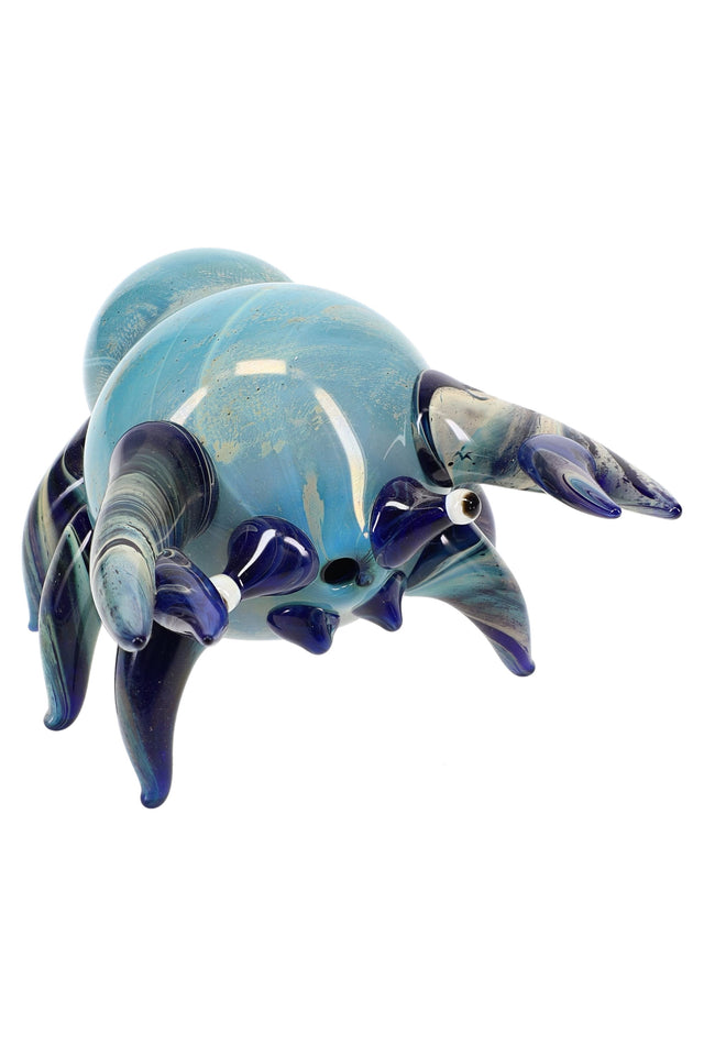 Silver-fumed glass crab hand pipe in ocean blue with sculpted legs and claws, rounded shell body, and tabletop-stable design.