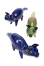 Silver-fumed glass pig hand pipe with top-mounted bowl, snout mouthpiece, and stable standing legs; glossy blue and green assorted colors.