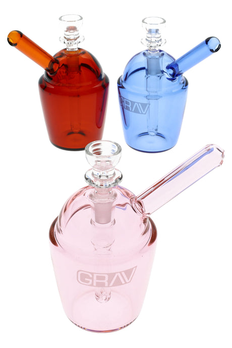 4.5-inch GRAV Slush Cup pocket bubbler in thick borosilicate with recessed 10 mm joint, 2-hole diffusion, and included Cup Bowl, shown in assorted colors on white.