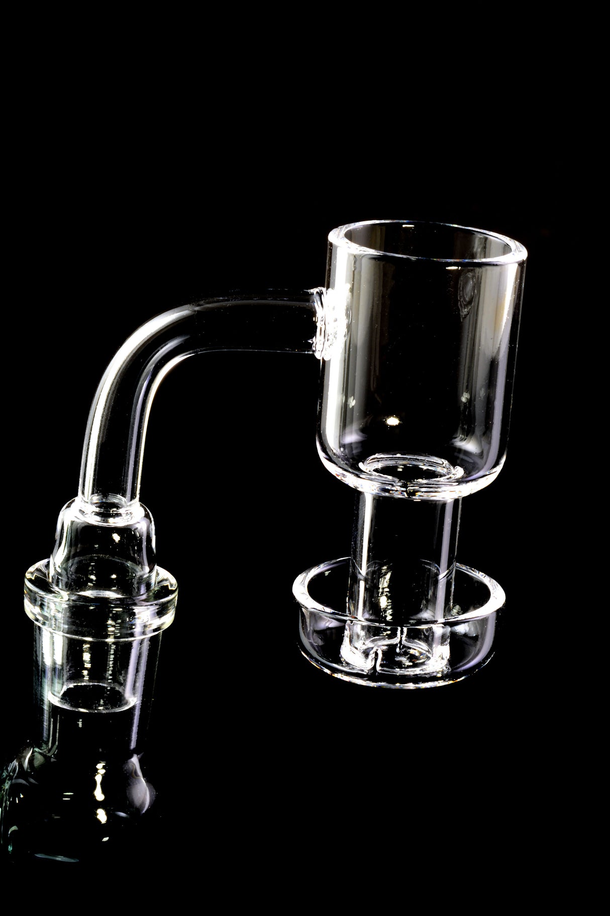 Quartz terp slurper banger mounted on a rig, 90-degree neck with 14.5 mm male joint and lower dish ready for use with marbles.