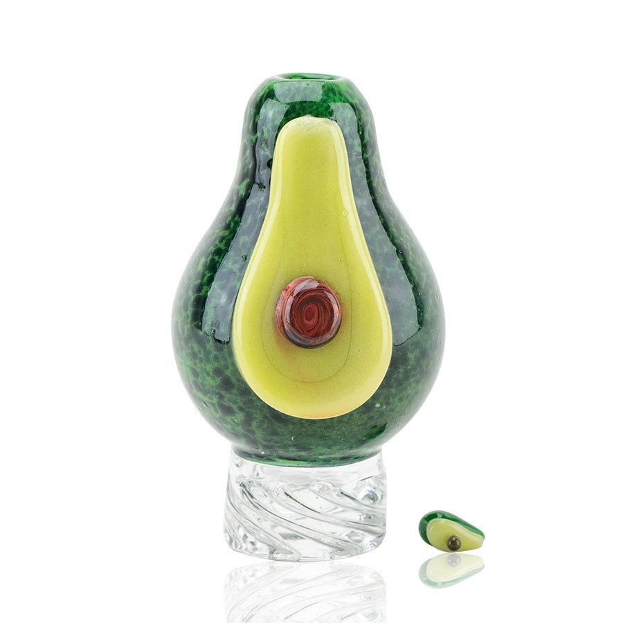 Front view of US-made avocado spinner cap on white backdrop showing raised pit detail and clear spinner base.