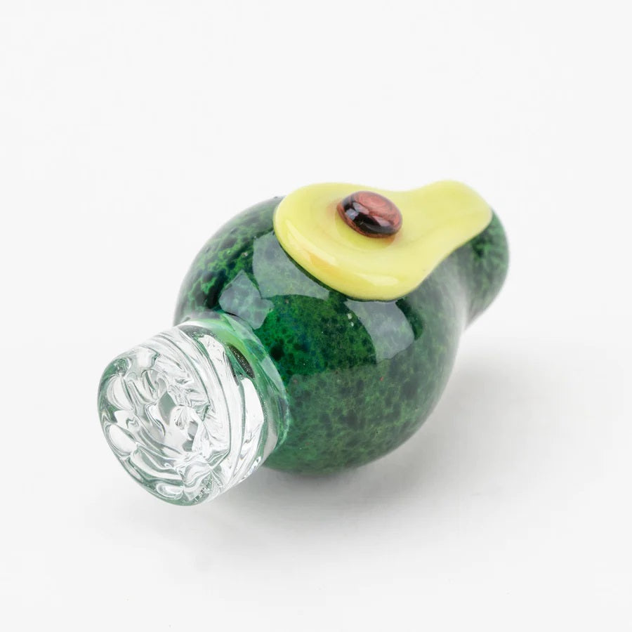 Bottom angle of Empire Glassworks avocado spinner cap focusing on clear spiral-cut base designed to rotate pearls.