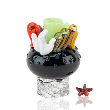 Black coral reef spinner cap with lime center and twisted clear base, shown beside a red starfish terp pearl.