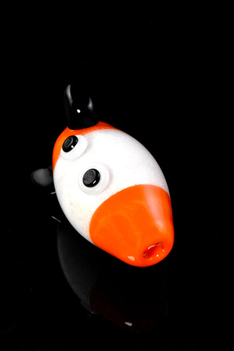 Angled shot of rocket bubble cap on black background showing nose airflow hole and one fin for directional control.