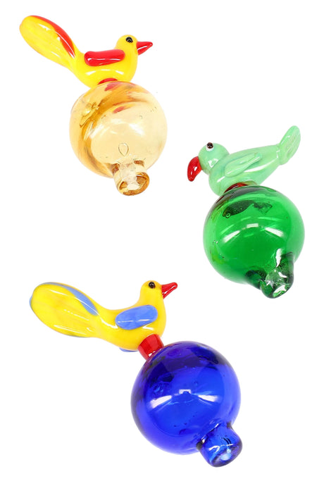 Bird-shaped glass bubble carb cap in yellow, green, and cobalt blue with round chamber and short tip for dab rigs.