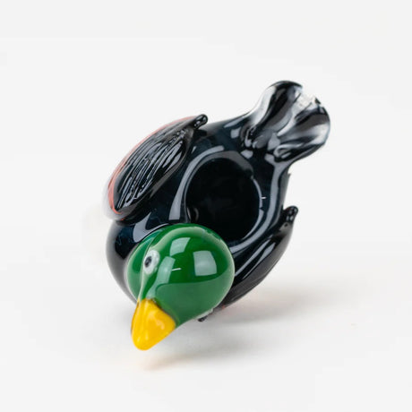 Top view of duck bong bowl revealing deep herb dish opening set into a glossy black body and green head.