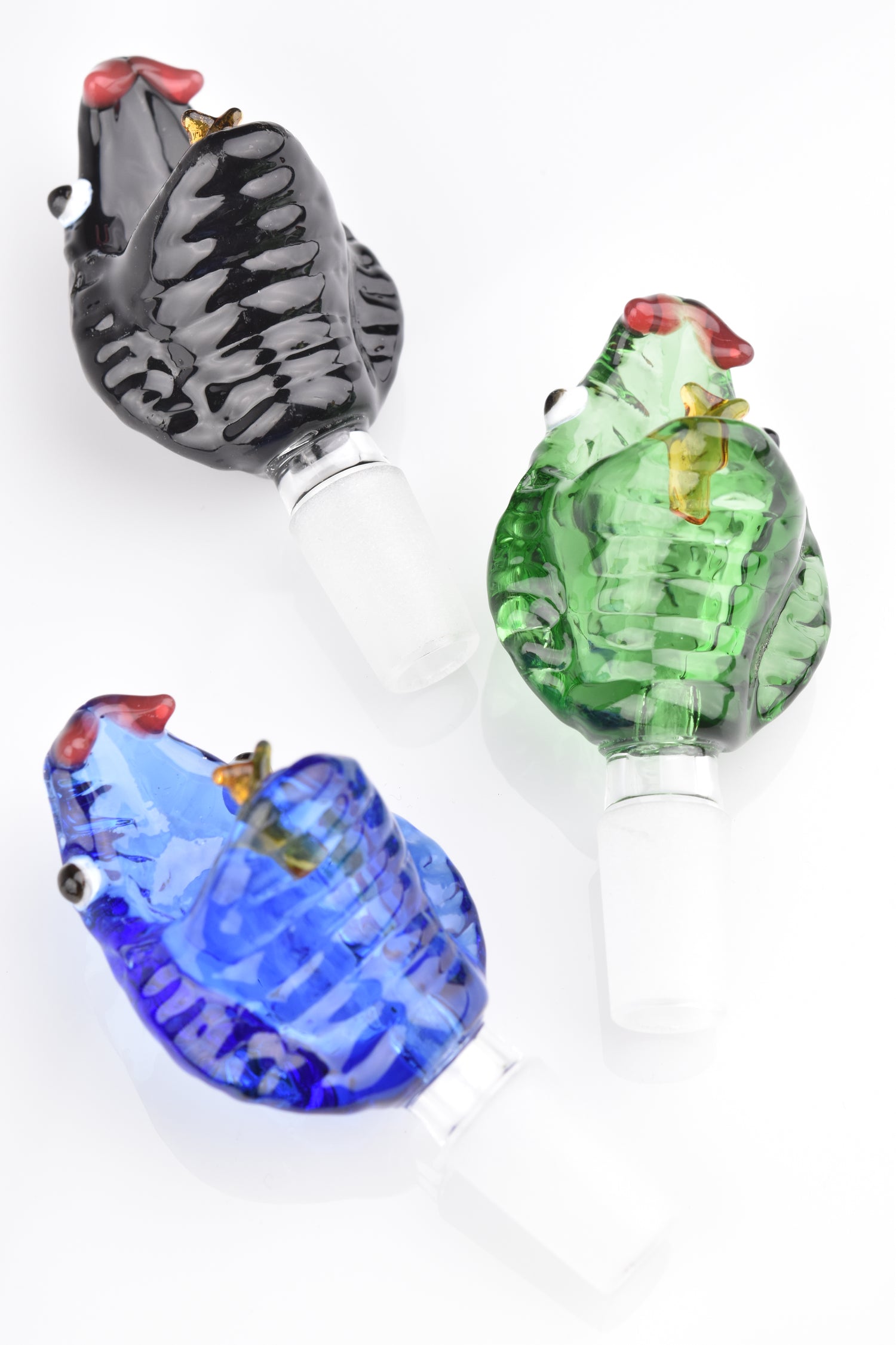Trio of colored glass snake-head bong bowls with 14.5 mm male frosted joints in black, green, and blue; sculpted scales and deep cup design.