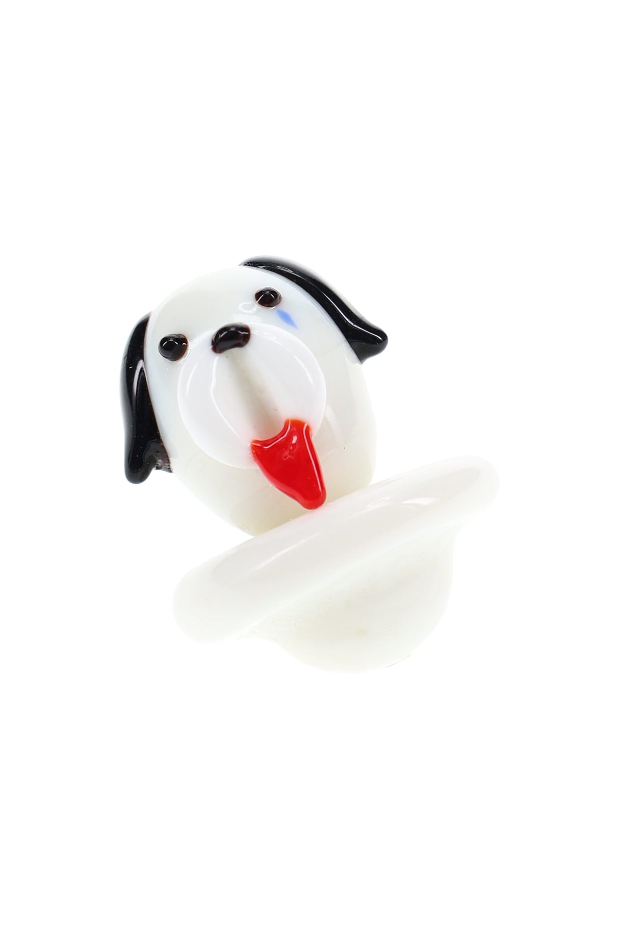 White glass dog carb cap with black ears and red tongue, bubble base designed to control airflow on a dab rig.