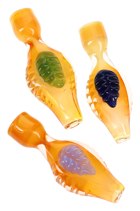 Gold-fumed color-changing glass chillum with raised leaf accent and ridged grip, compact 3.5-inch one-hitter hand pipe.