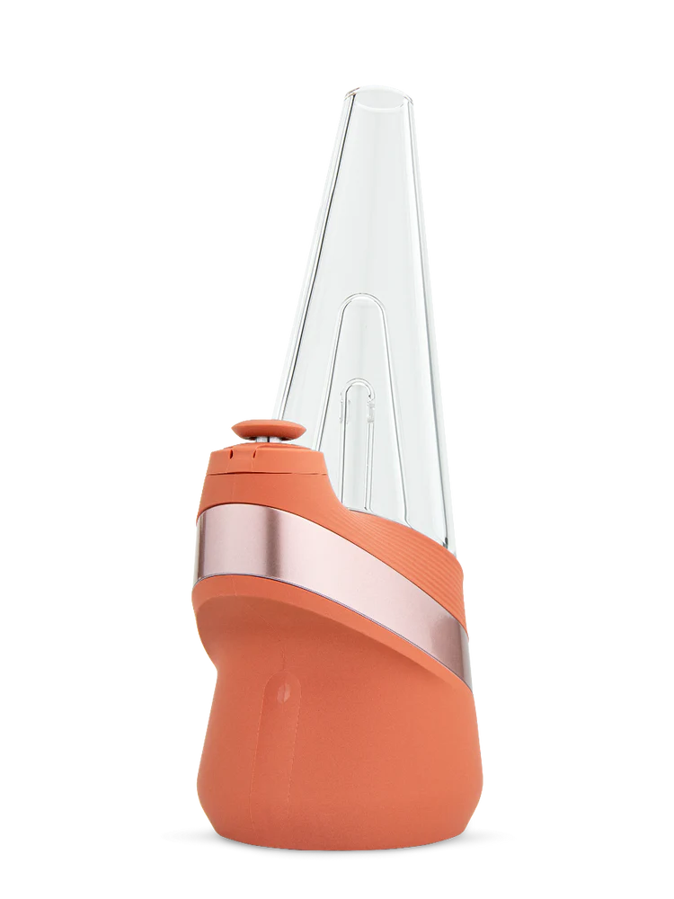 Puffco New Peak smart e-rig in limited Canyon orange with rose-metal band, clear conical glass top and joystick cap shown from front.