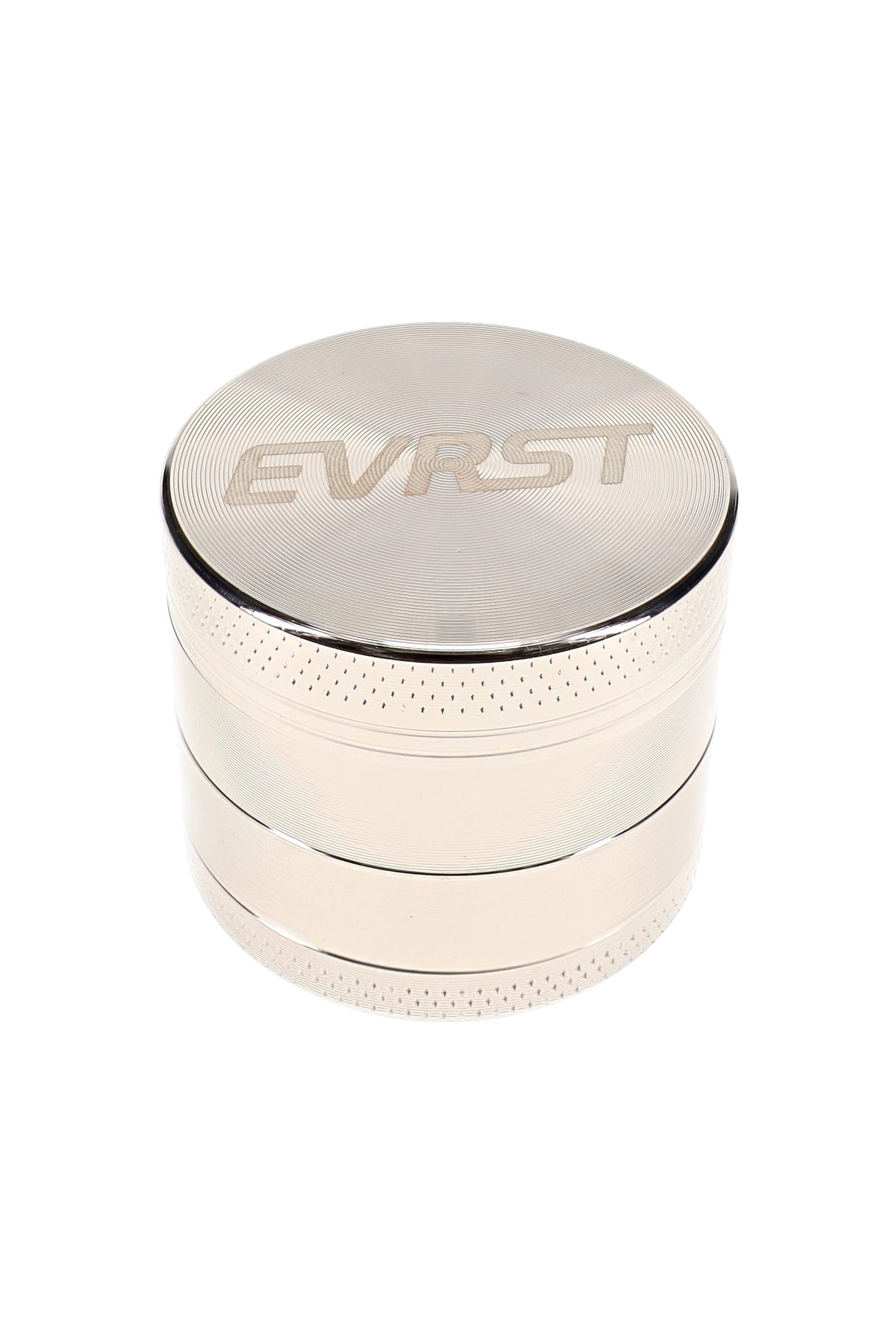 Polished EVRST metal herb grinder with engraved lid logo and textured grip bands