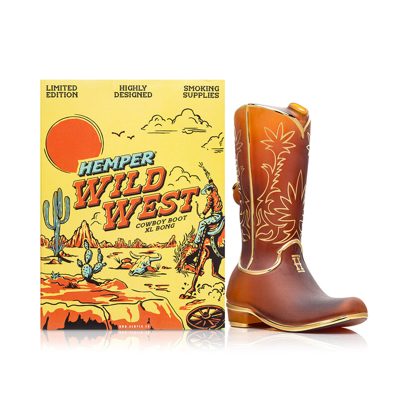 Front view of Hemper Wild West cowboy boot bong next to illustrated “Wild West” gift box, ready-for-display shot for standout novelty water pipe.