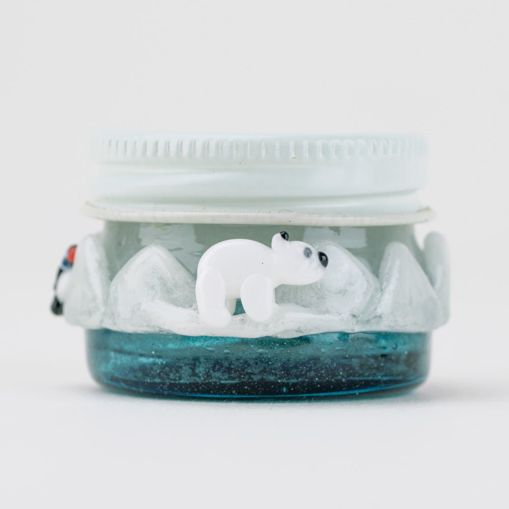 Empire Glassworks arctic terp jar front view with blue glass base and sculpted polar bear detail