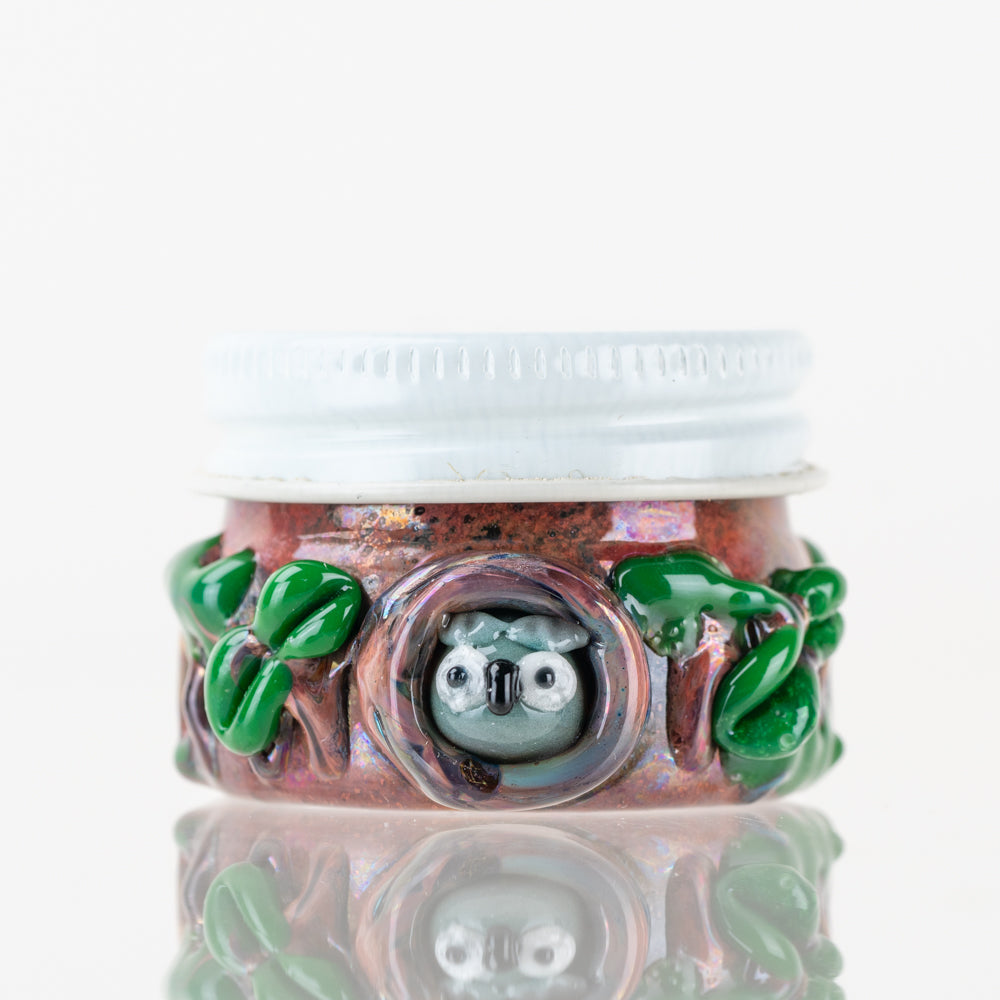 Empire Glassworks Hootie’s Forest terp jar front view with owl face and leafy glass detail