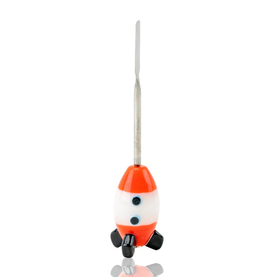 Front view of 5-inch space-cruiser glass dabber on white backdrop highlighting stainless spatula scoop and balanced rocket body with two blue portholes.