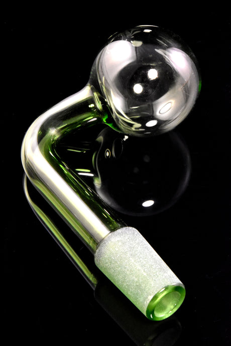 Close view of green L-shaped oil burner with clear globe and textured frosted 14.5 mm male joint on black background.